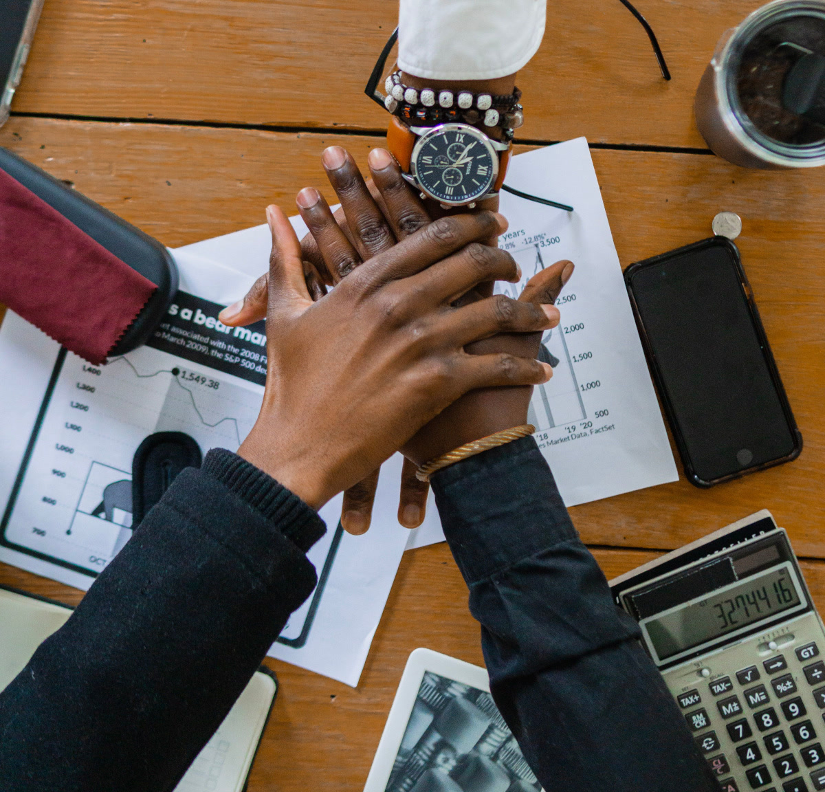 A team bringing their hands together to show collaboration